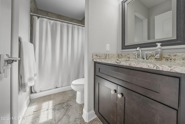 bathroom with walk in shower, vanity, and toilet