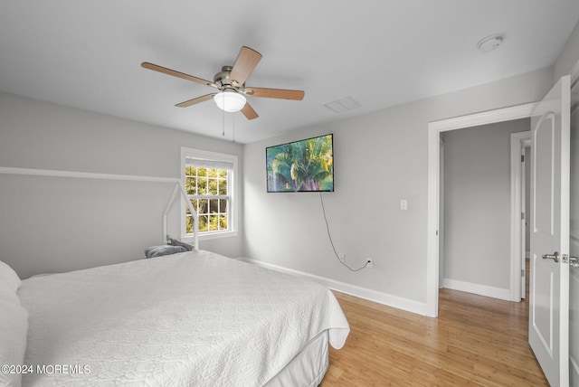 bedroom featuring ceiling fan and light hardwood / wood-style flooring