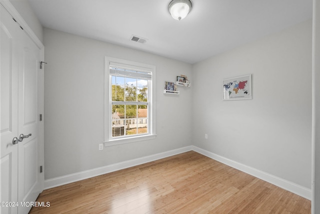 unfurnished room with light hardwood / wood-style flooring