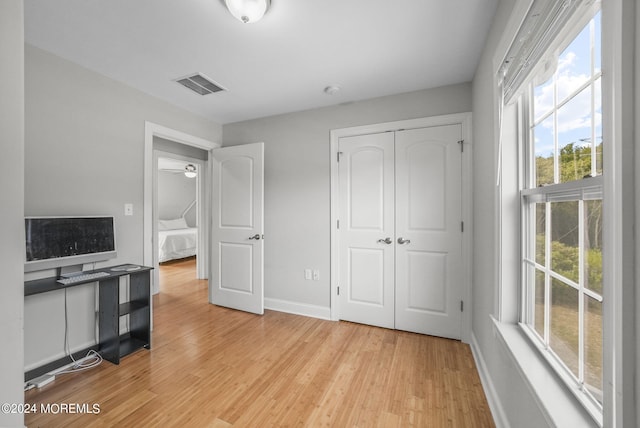 bedroom featuring light hardwood / wood-style flooring and a closet