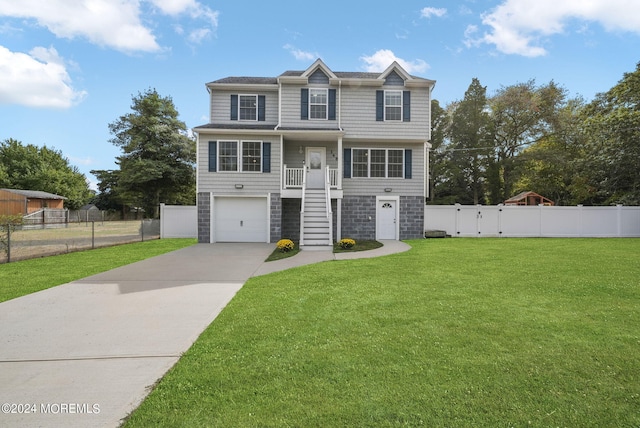 view of front facade featuring a garage and a front lawn