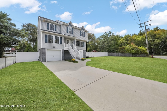 view of front of home featuring a garage and a front lawn