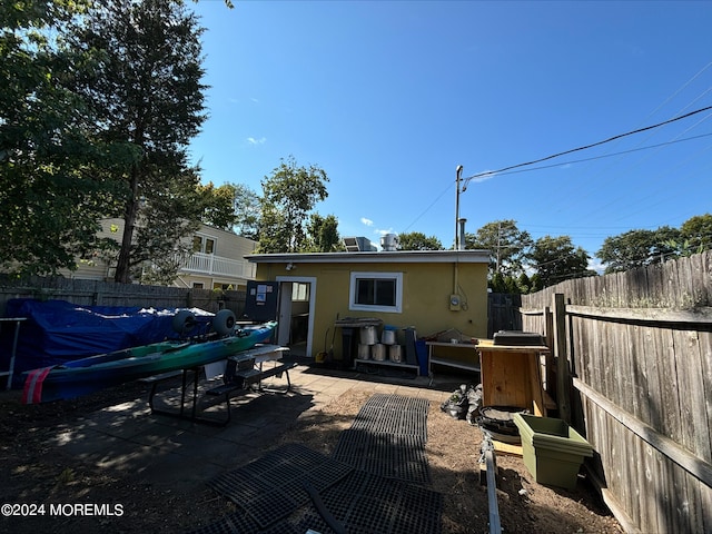 rear view of property with a patio area