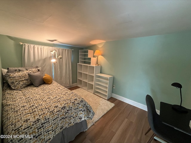 bedroom featuring dark hardwood / wood-style flooring