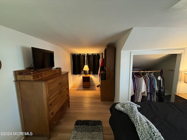 bedroom featuring light wood-type flooring and a closet