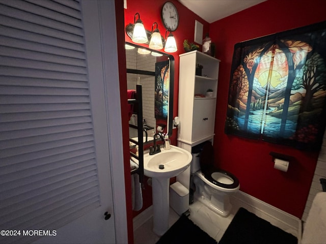 bathroom with tile patterned flooring and toilet