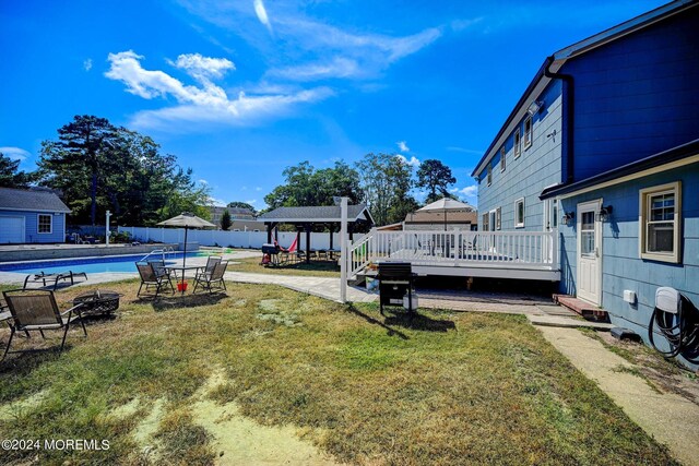 view of yard with a patio, a gazebo, a pergola, and a swimming pool side deck