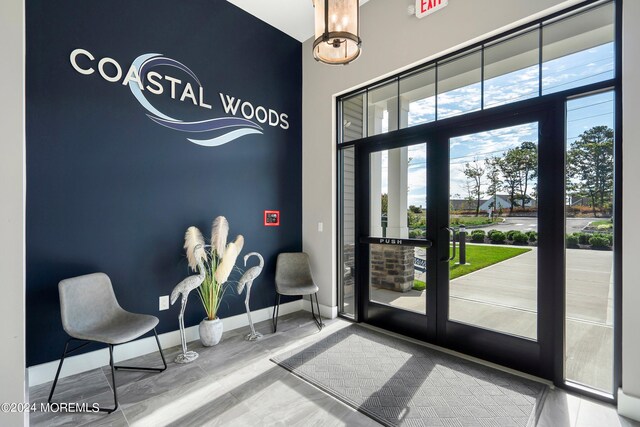 entryway featuring hardwood / wood-style floors and french doors