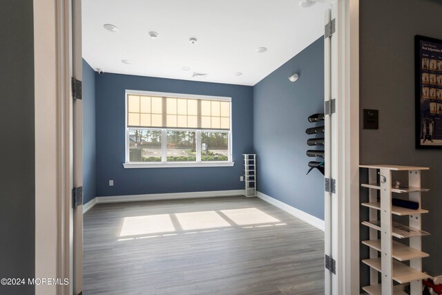 unfurnished room featuring hardwood / wood-style floors