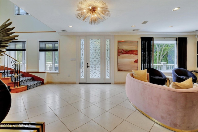 interior space with light tile patterned floors and crown molding