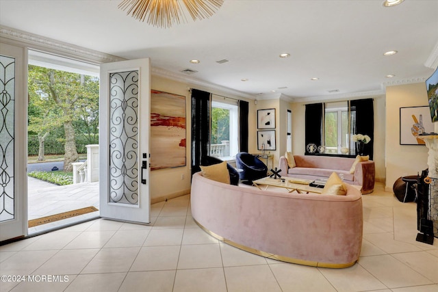 tiled living room featuring ornamental molding and a wealth of natural light