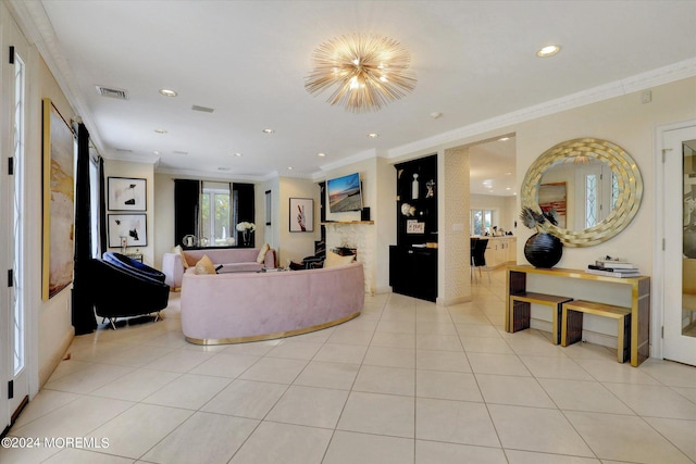 living room with ornamental molding and light tile patterned floors