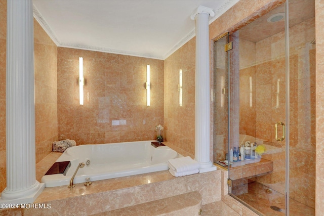 bathroom featuring ornamental molding, plus walk in shower, decorative columns, and tile walls