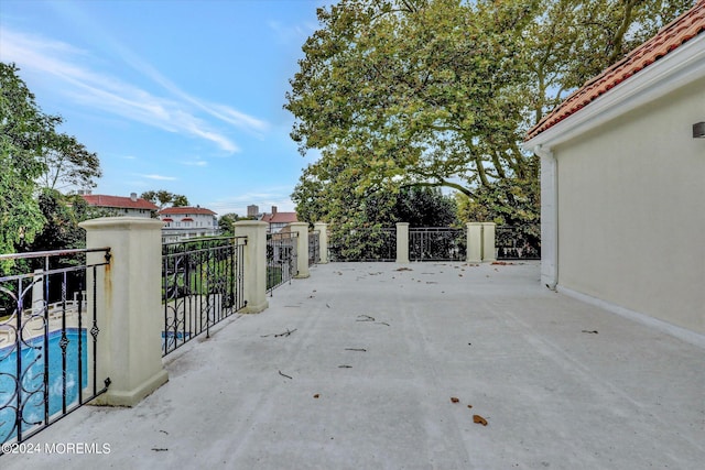 view of patio with a fenced in pool