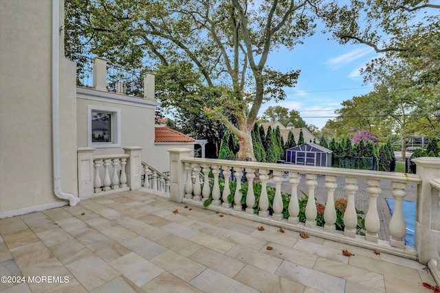 view of patio / terrace with a storage unit