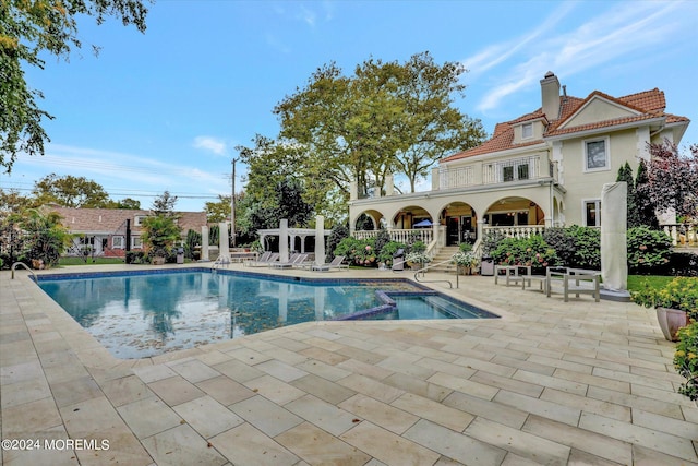 view of swimming pool with a patio area