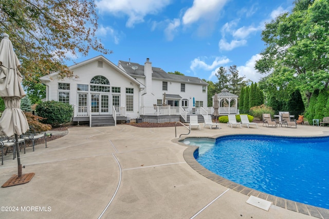 view of swimming pool with a patio, a gazebo, and a deck