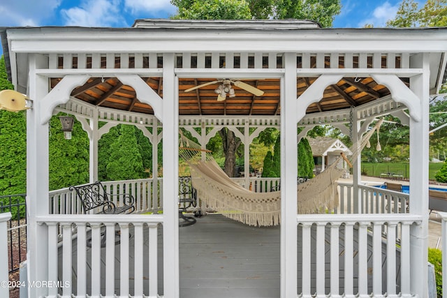 deck with a gazebo and ceiling fan