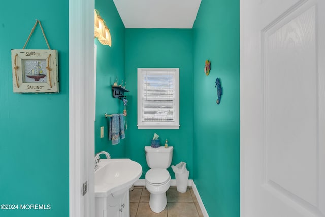 bathroom with sink, tile patterned floors, and toilet