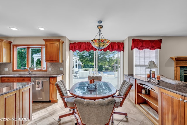 tiled dining space featuring sink