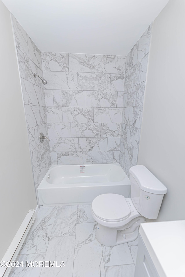 full bathroom with baseboard heating, tiled shower / bath combo, and toilet