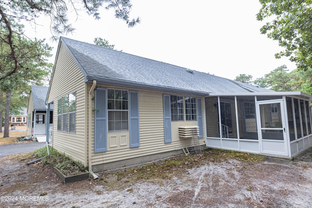 rear view of house with a sunroom