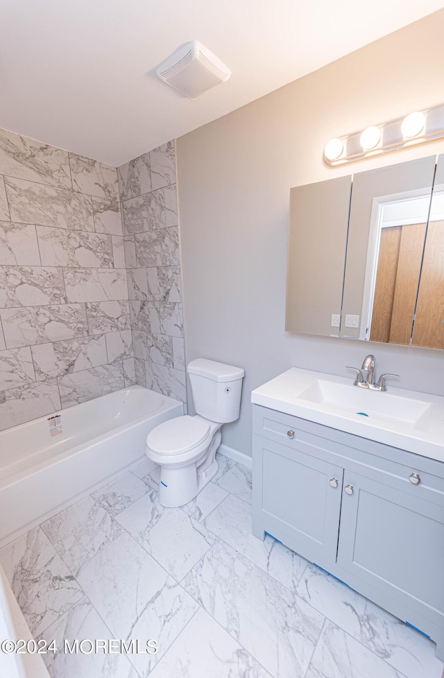 bathroom with washtub / shower combination, vanity, toilet, and marble finish floor