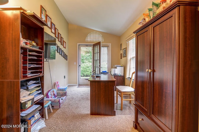 office with light carpet and lofted ceiling