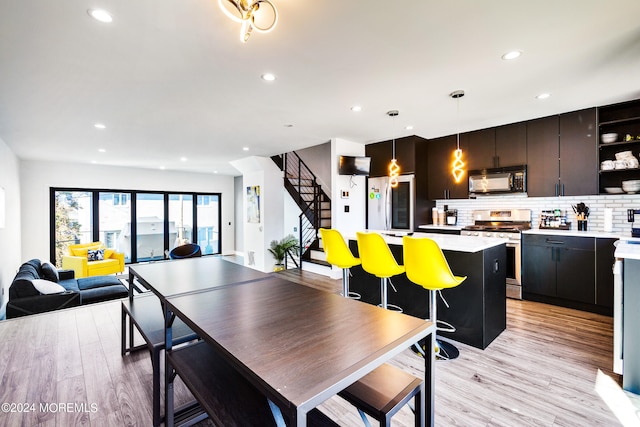 dining room with light wood-type flooring