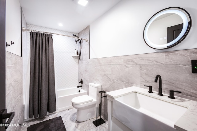 full bathroom featuring vanity, tile walls, shower / bath combo with shower curtain, and toilet