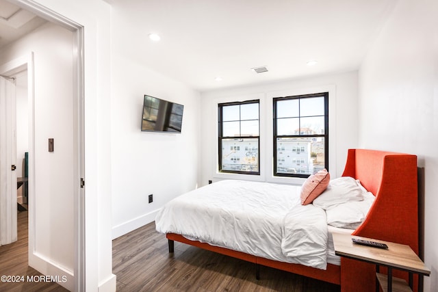 bedroom featuring dark wood-type flooring