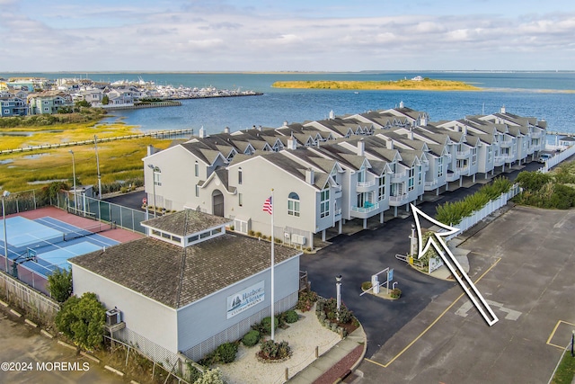 birds eye view of property with a water view