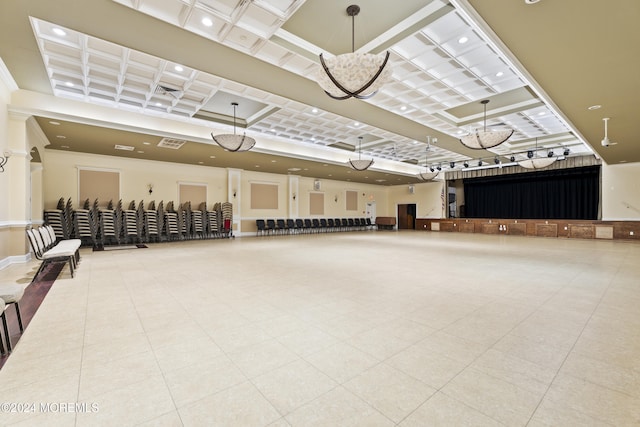 interior space with coffered ceiling and a high ceiling