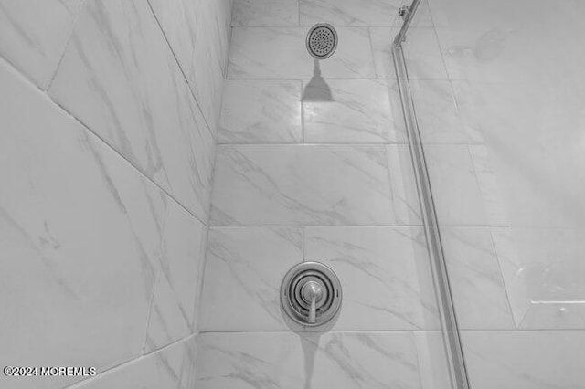 details with a tile shower