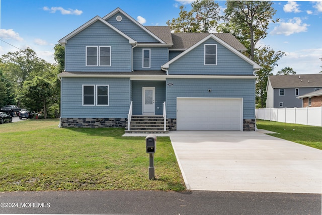 craftsman-style home with a garage and a front lawn