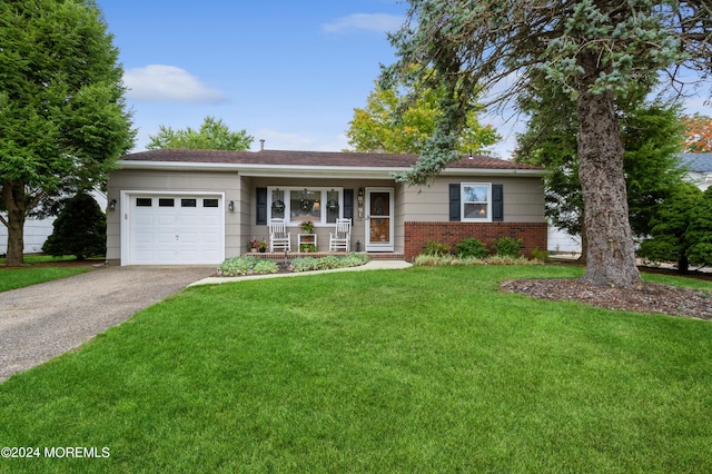 ranch-style home with a front lawn, a porch, and a garage