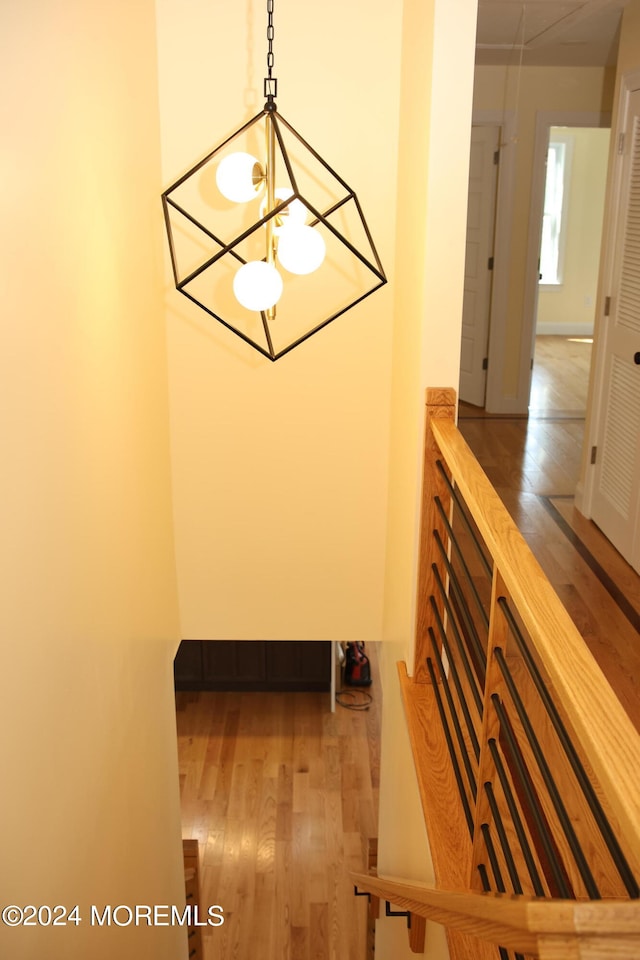 interior space featuring a notable chandelier and hardwood / wood-style flooring