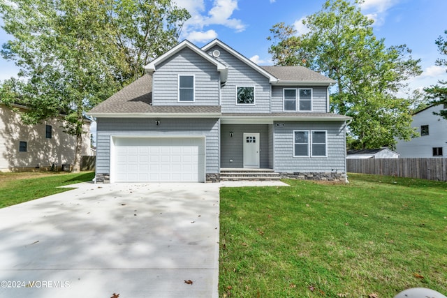 view of front facade with a front lawn and a garage