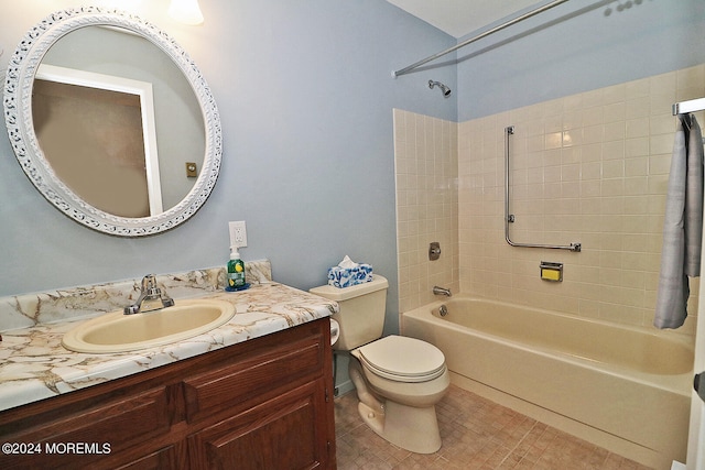 full bathroom with tiled shower / bath combo, tile patterned flooring, vanity, and toilet