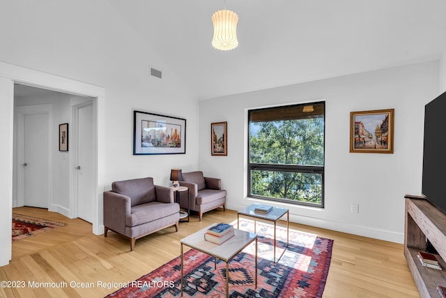 49 N Cherokee Ln, Brick, NJ 08724 - living room with light wood-type flooring, baseboards, and high vaulted ceiling
