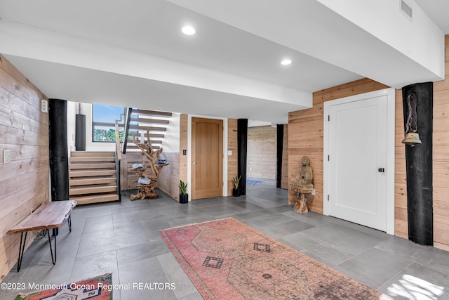 49 N Cherokee Ln, Brick, NJ 08724 - below grade area featuring wooden walls, stairway, and recessed lighting