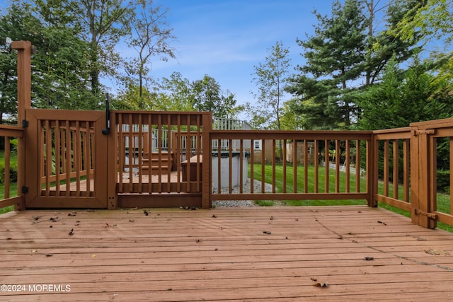 wooden terrace with a yard