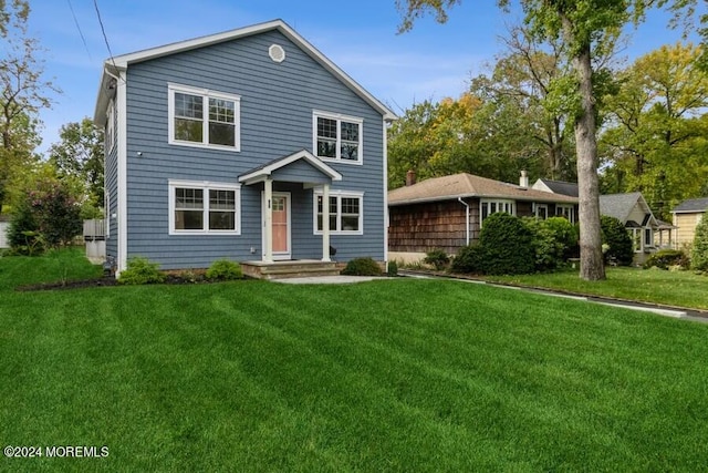 view of front of home with a front lawn