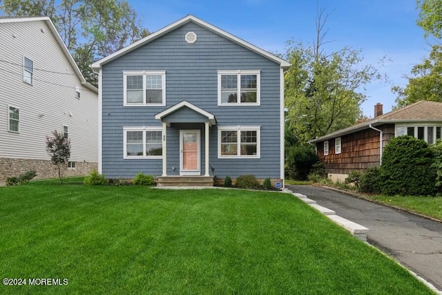 front facade with a front lawn