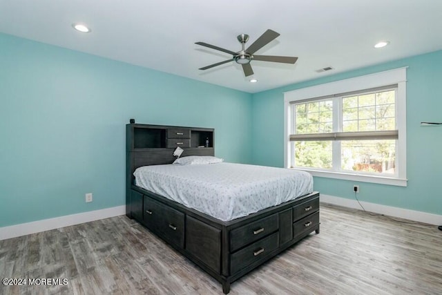 bedroom featuring ceiling fan and light hardwood / wood-style flooring