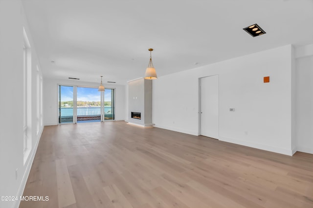 unfurnished living room featuring light wood-type flooring