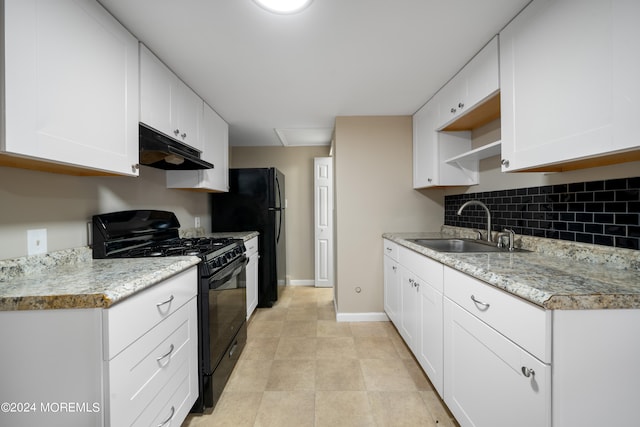 kitchen featuring decorative backsplash, black appliances, white cabinetry, and sink