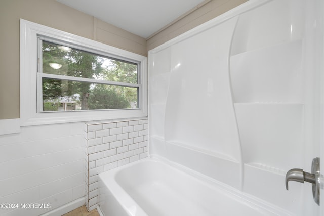 bathroom with tile walls