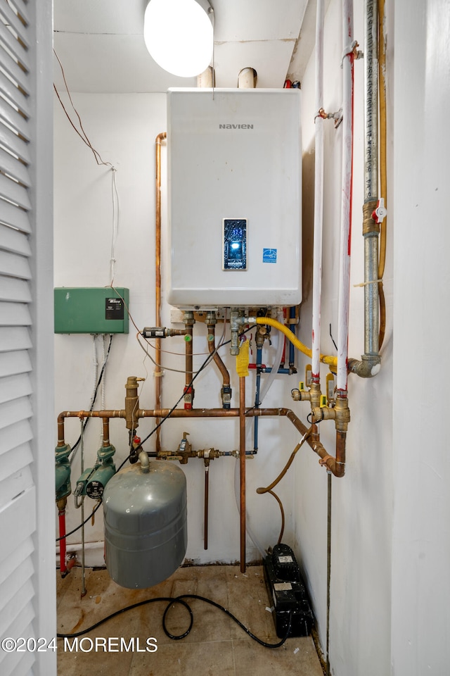 utility room featuring water heater