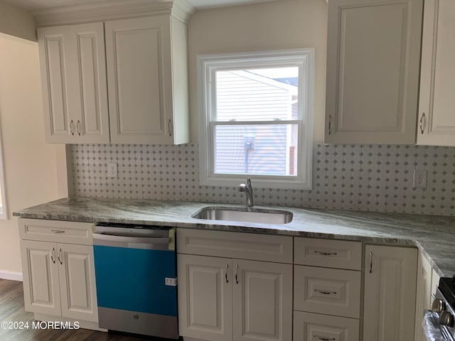 kitchen featuring white cabinets, appliances with stainless steel finishes, dark wood-type flooring, and sink